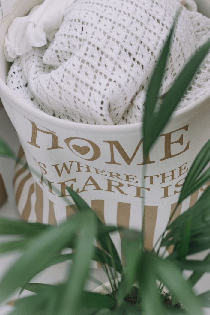 Home Soft textiles in a stylish bag with a plant, perfect for home decor inspiration.