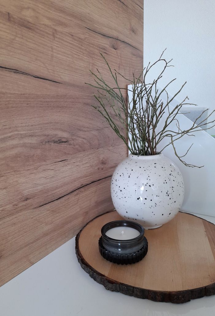 Crafting Captivating Headlines: Your awesome post title goes here Chic interior scene featuring a ceramic vase with decorative branches on a wooden tray.